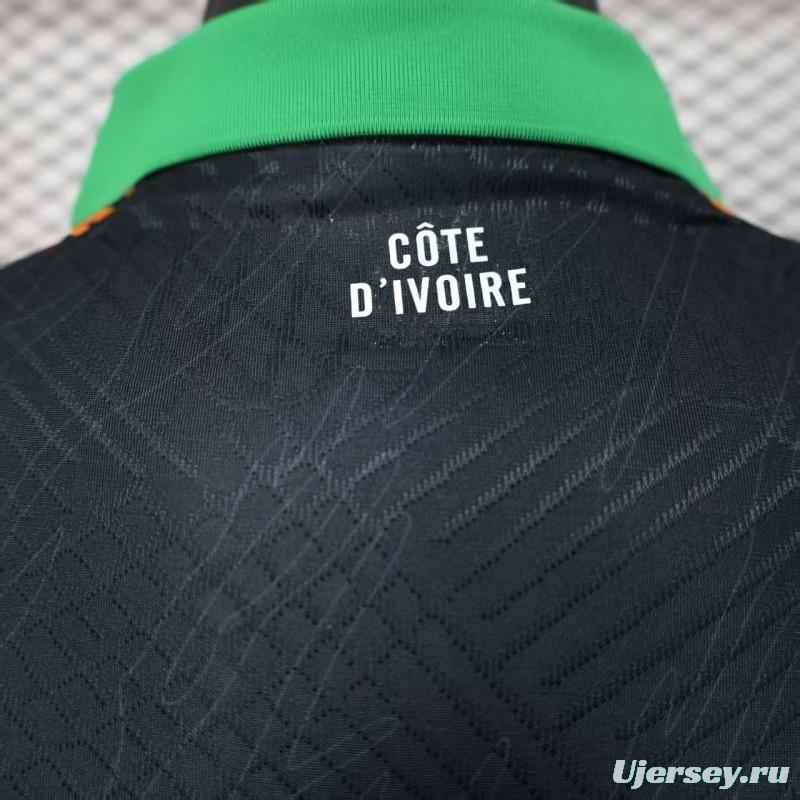 Player Version 2025 Ivory Coast Black with Elephant Graphic and Orange Stripes Jersey