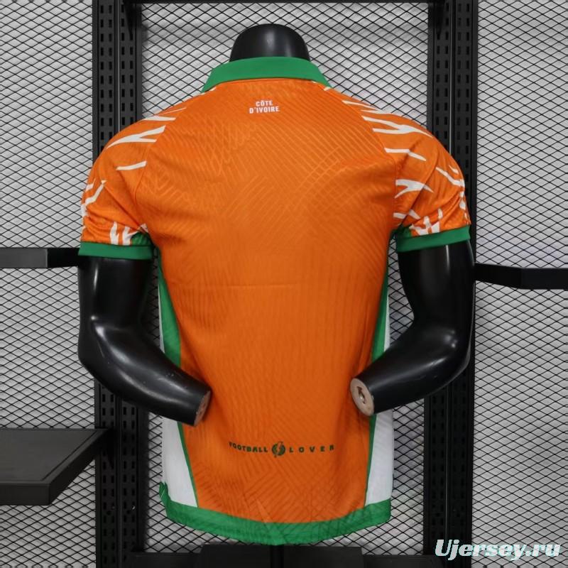 Player Version 2025 Ivory Coast Orange with Elephant Graphic and Green Accents Jersey